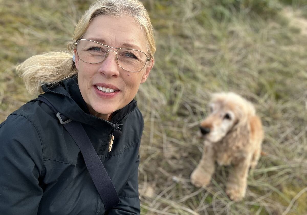 Author with a cocker spaniel outdoors enjoying simple exercise walking in the dunes